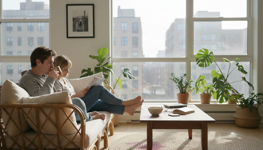 Couple enjoying rattan sofa in bright living room