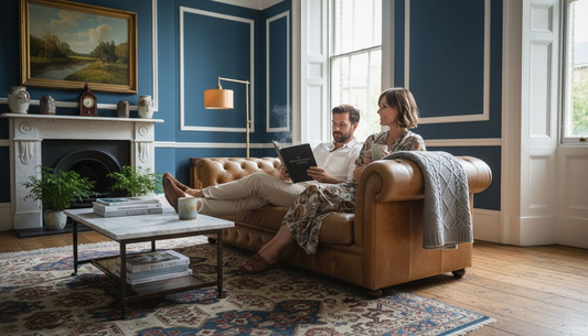 Couple relaxing on luxury sofa in British home